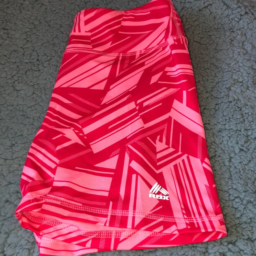 Pink and red tight athletic shorts from RBX
